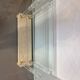Hollywood Regency console style in travertine, glass, and Lucite.
