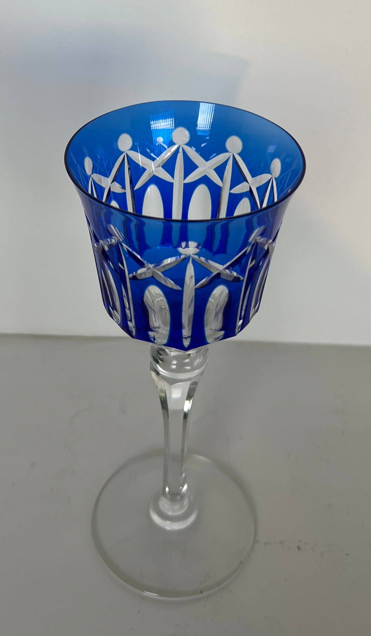 Set of twelve glasses in crystal tinted in different colours and cut with stars.
