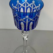 Set of twelve glasses in crystal tinted in different colours and cut with stars.