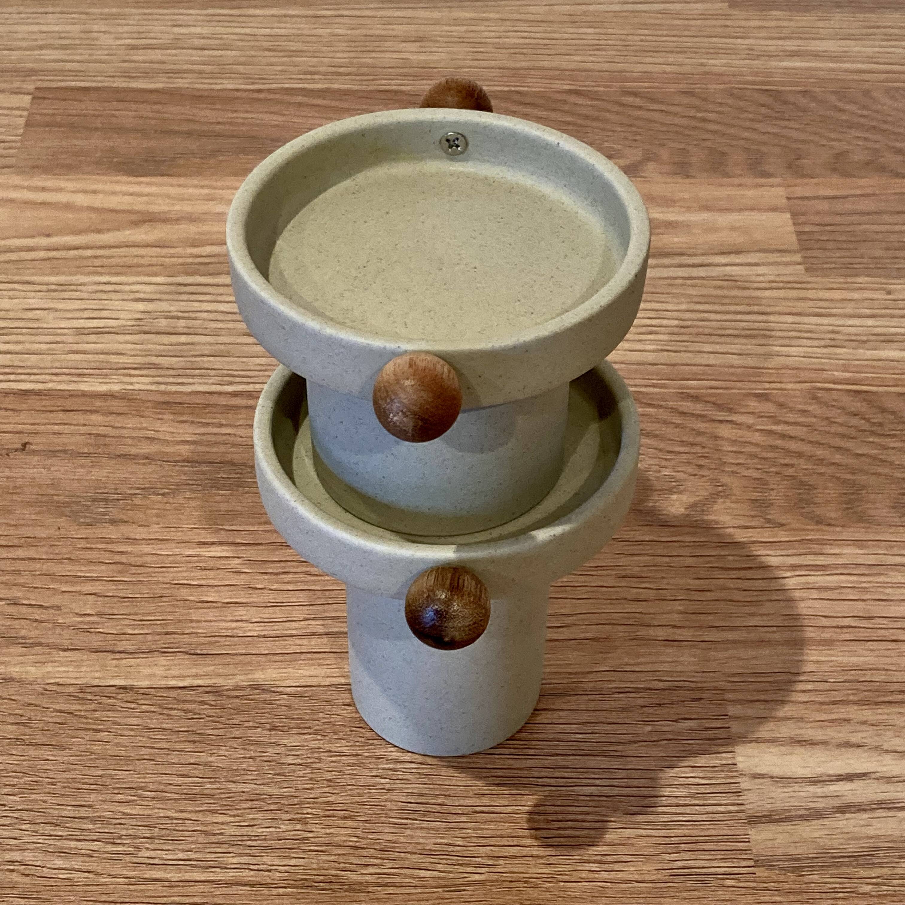 A pair of Scandinavian design candle holders.