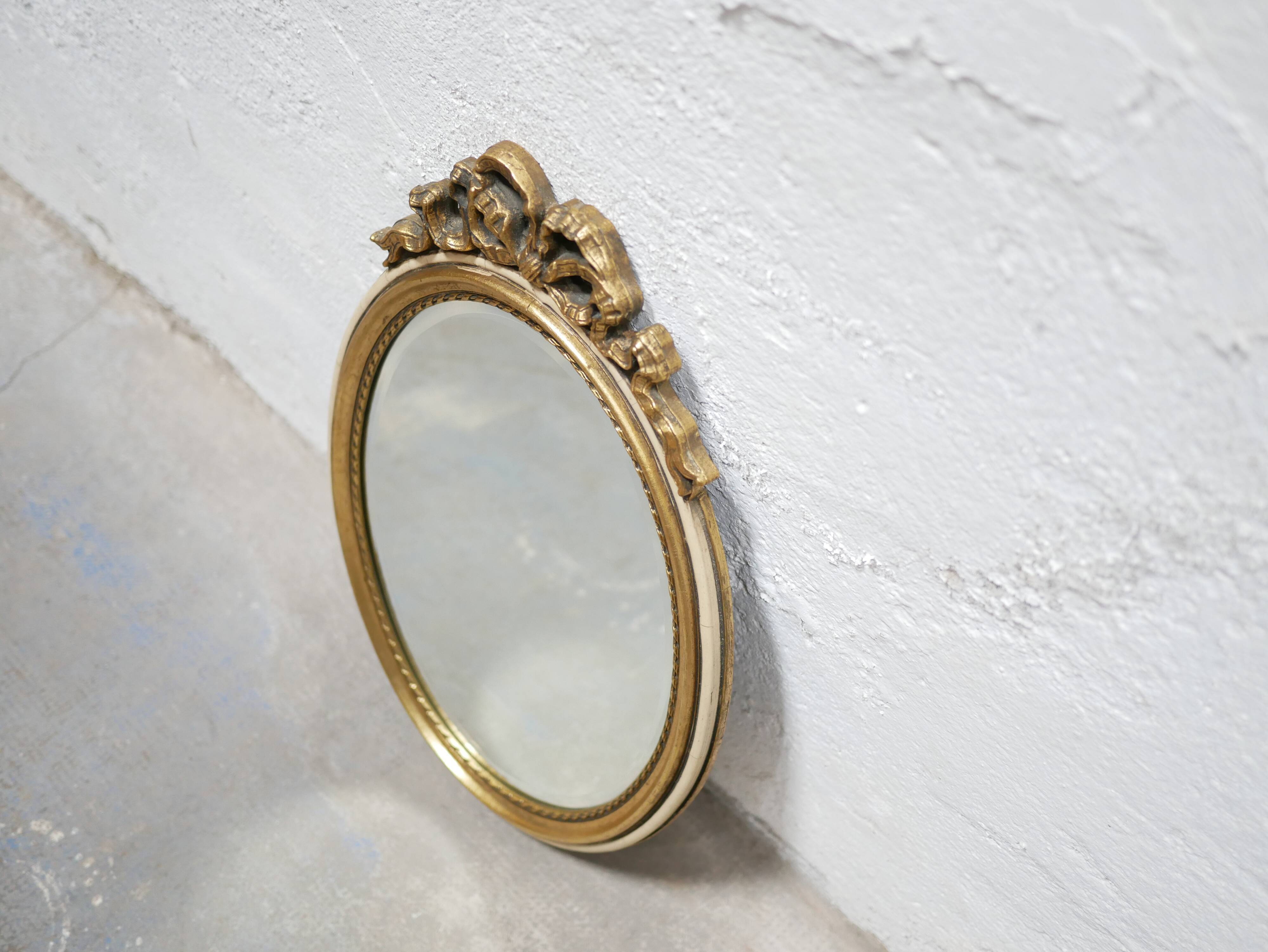 Old oval mirror Louis XVI style in gilded wood 50cm x 34cm