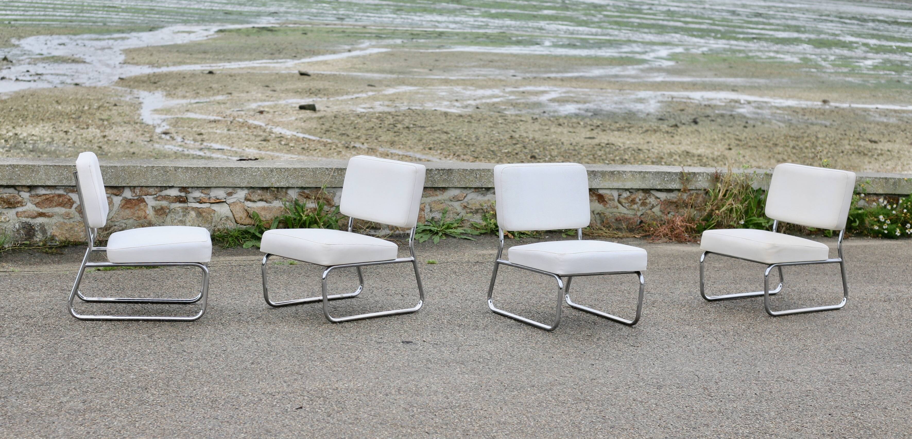 4 armchairs forming a modular sofa. Steel, imitation leather, 70s