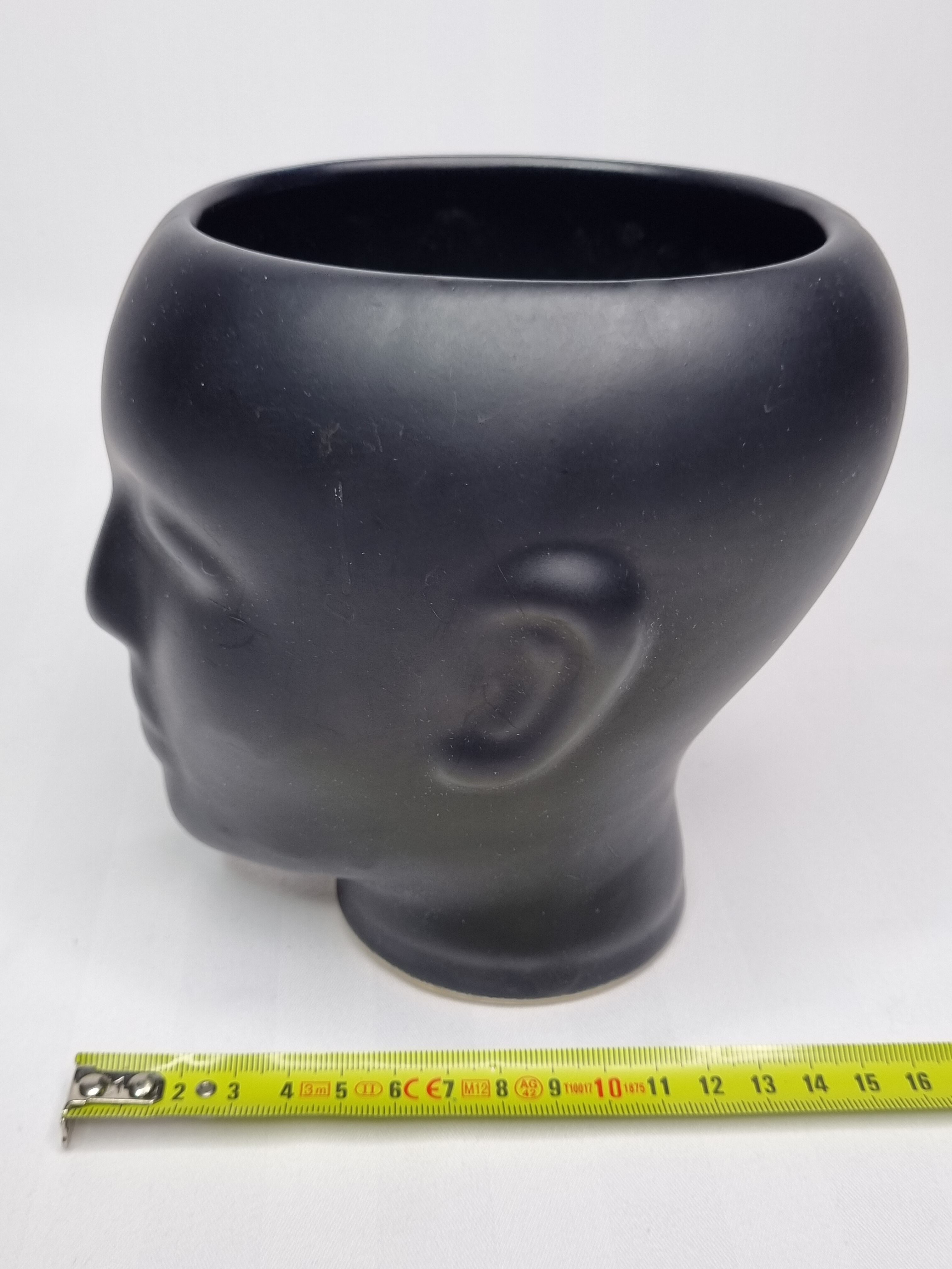 Anthropomorphic pot cover in matt black glazed ceramic, 80s