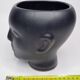 Anthropomorphic pot cover in matt black glazed ceramic, 80s
