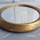 Golden oval mirror 34x28cm