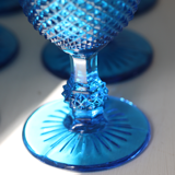 Old table set in blue pressed moulded glass