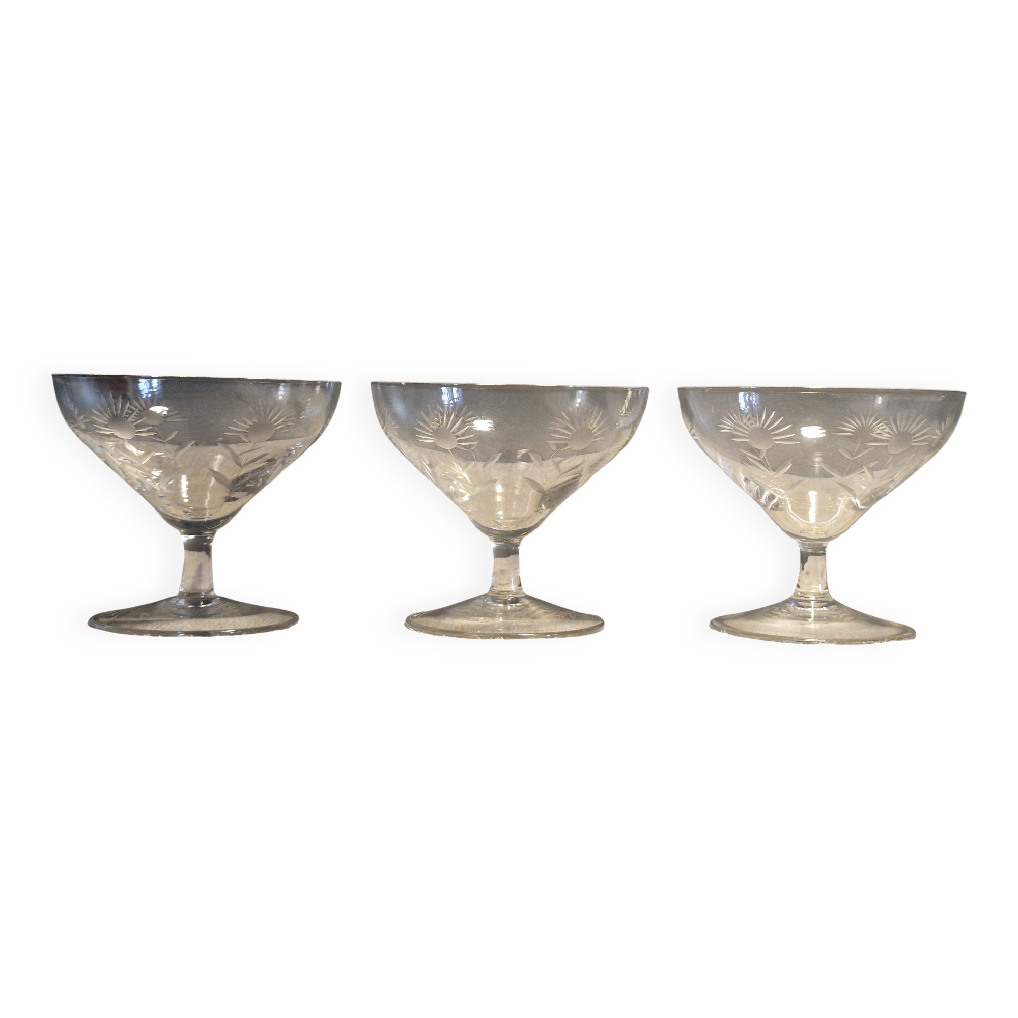 3 antique champagne coupes in engraved crystal with large daisies.