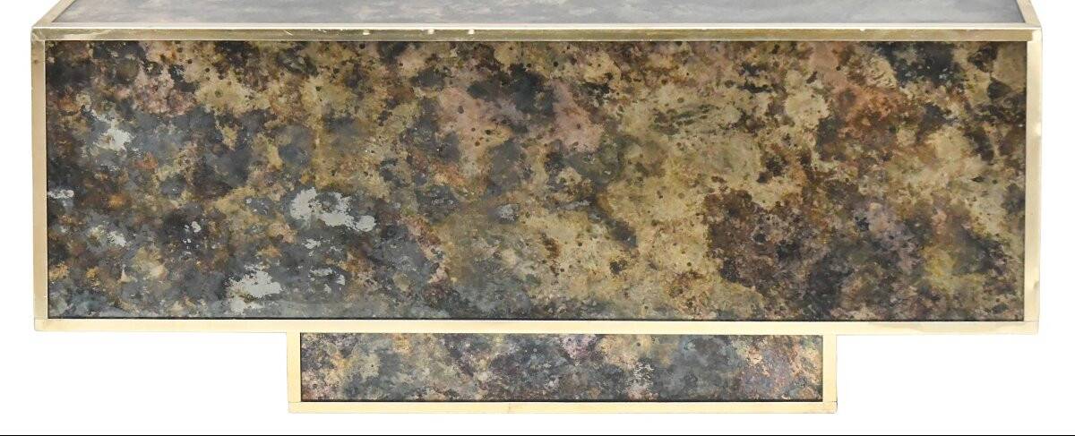 Marble glass coffee table with "solar eruption" decor.