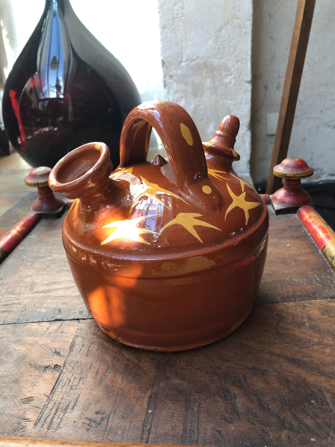 Orange glazed terracotta gargoulette