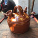 Orange glazed terracotta gargoulette