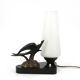 Art Deco lamp with swallow sculpture, marble base, opaque white globe.