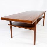 Coffee table with shelf in teak of danish design from the 1960s.
