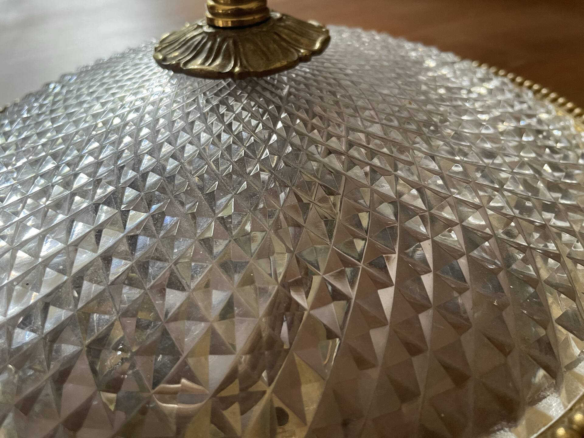 Antique ceiling light in bronze and cut crystal with diamond points.