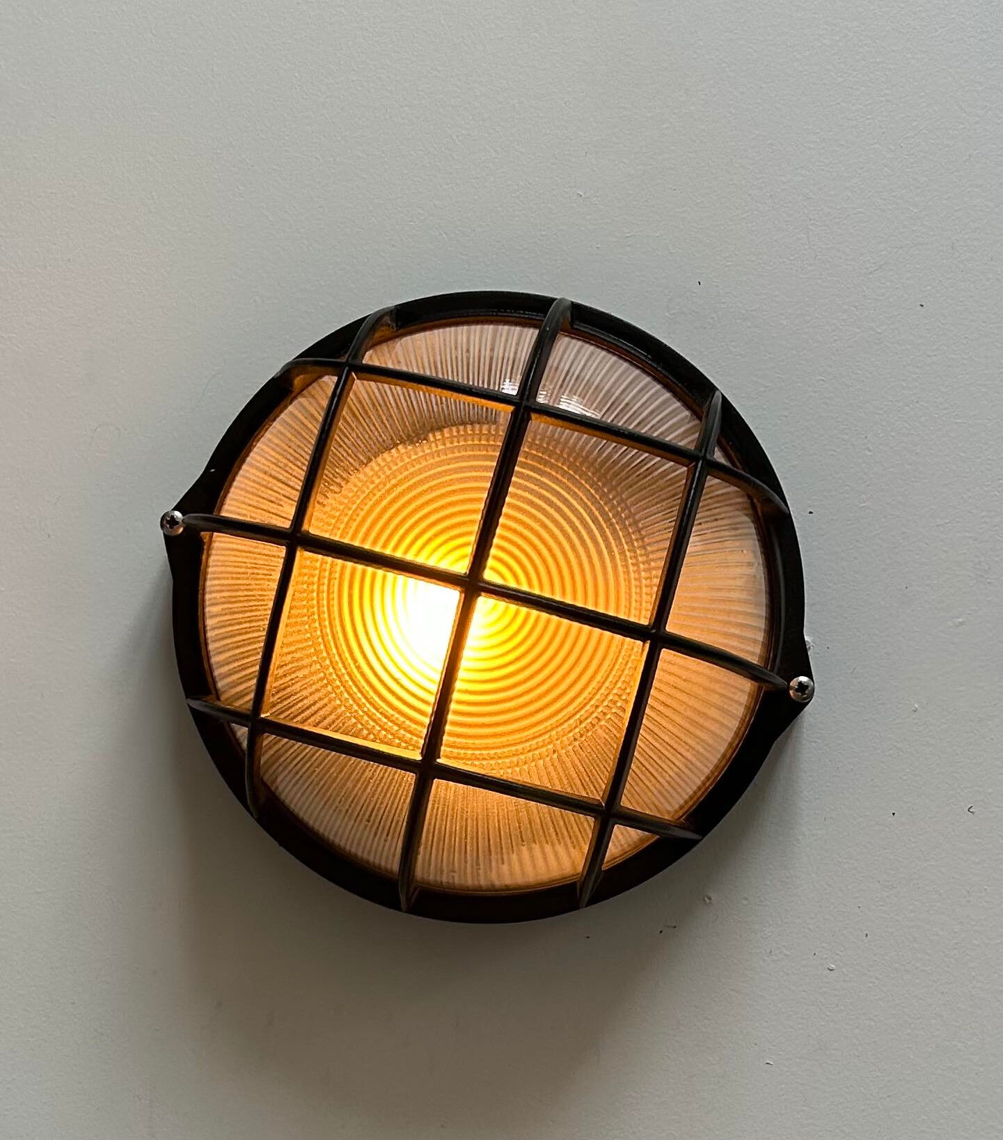 Vintage wall lamp, black metal and ridged glass, France 1980.