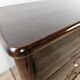 Chest of drawers with five drawers in wood and brass