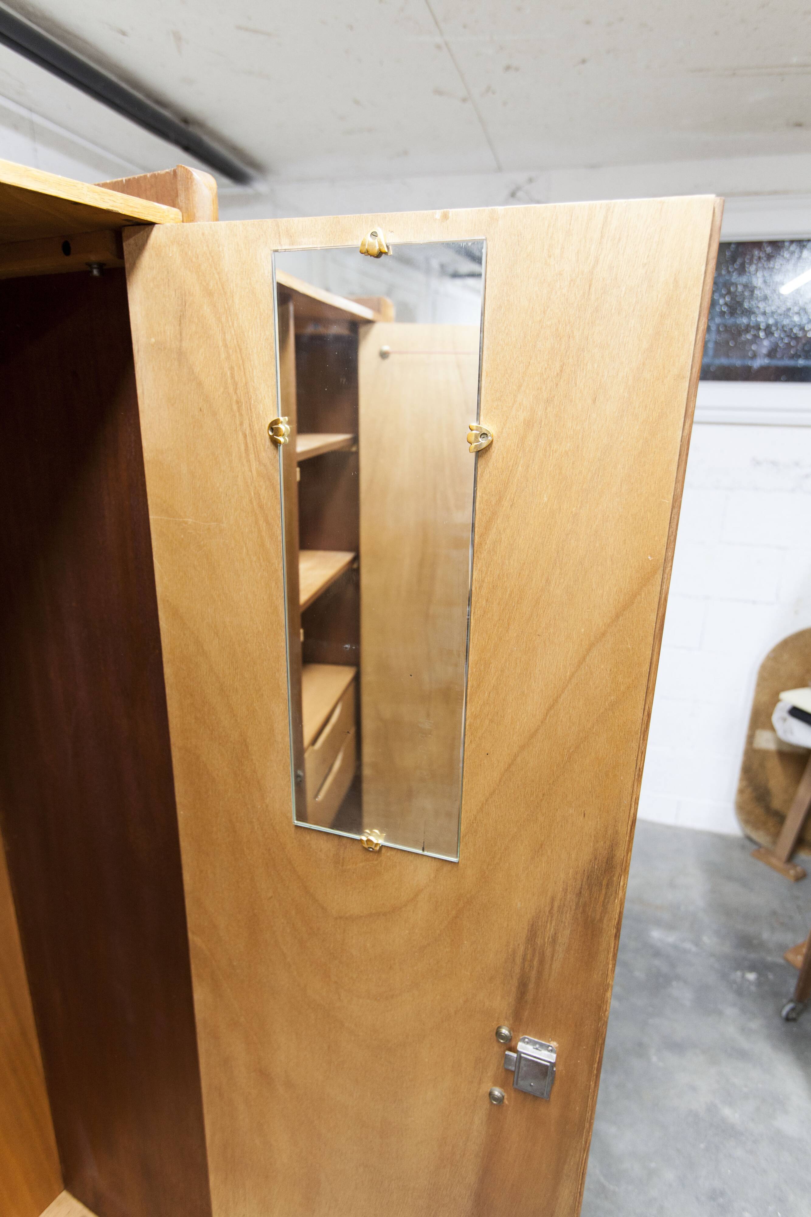 1950s Mid-Century Modern oak armoire with two doors and two drawers.
