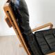 Scandinavian armchair in wood and leather.
