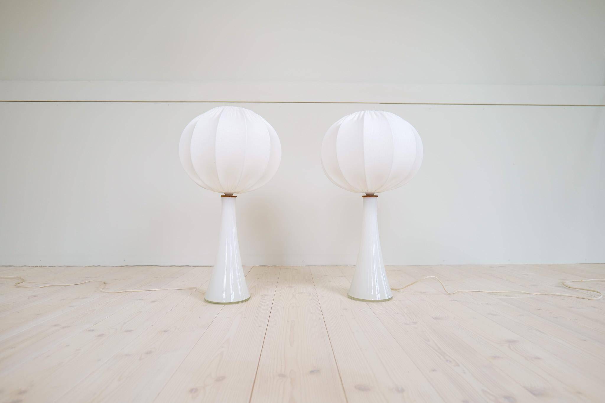 Pair of mid-century opaline glass table lamps with cotton shades by Bergboms, Sweden, 1960.