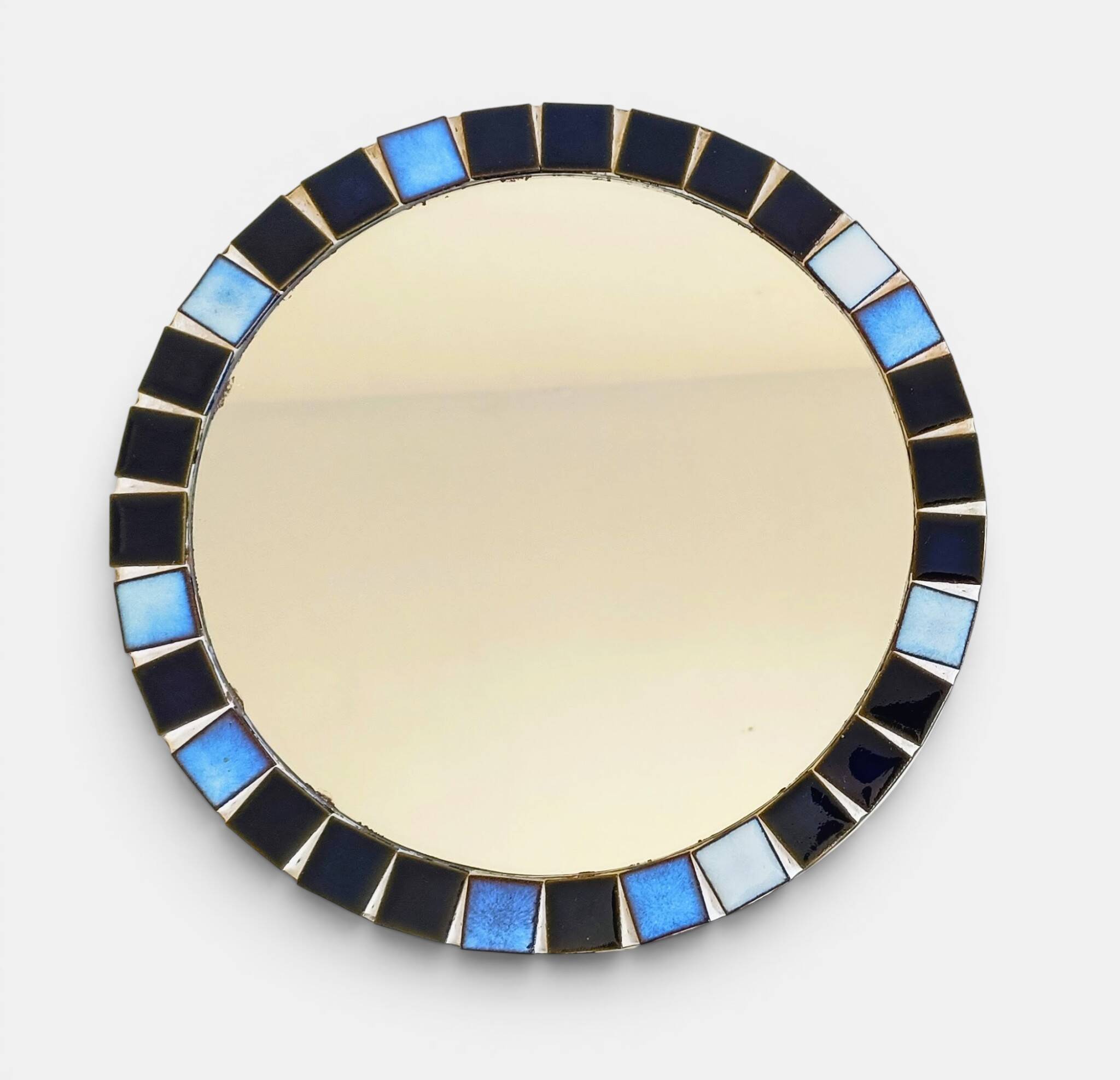 Round mosaic mirror in the style of Vallauris, France circa 1970.
