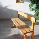 Solid wood school bench from the early 20th century.
