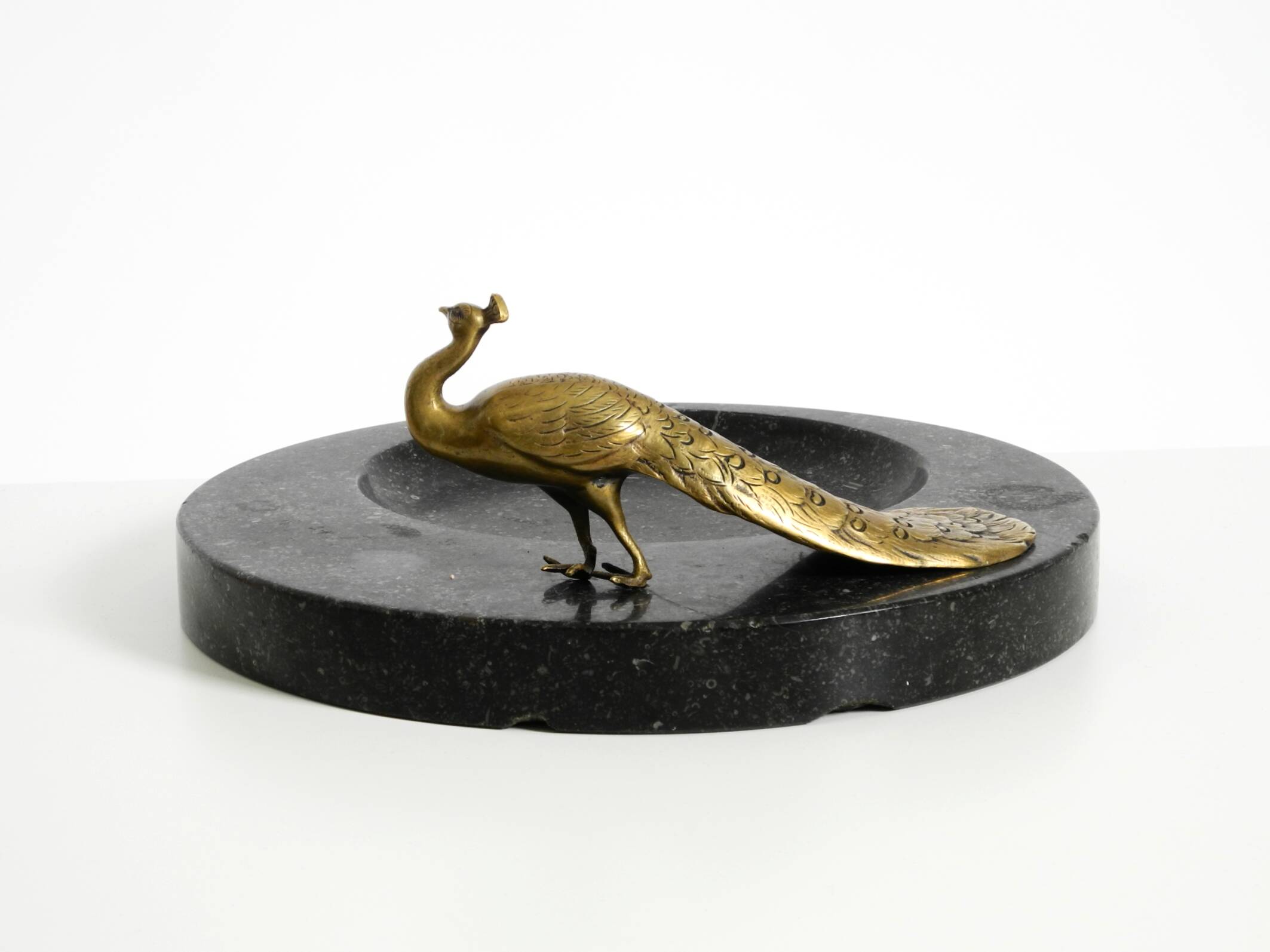 Beautiful, large black granite valet tray featuring a brass peacock, circa