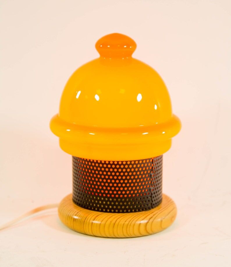 Vintage table lamp in orange glass and black perforated metal 70s