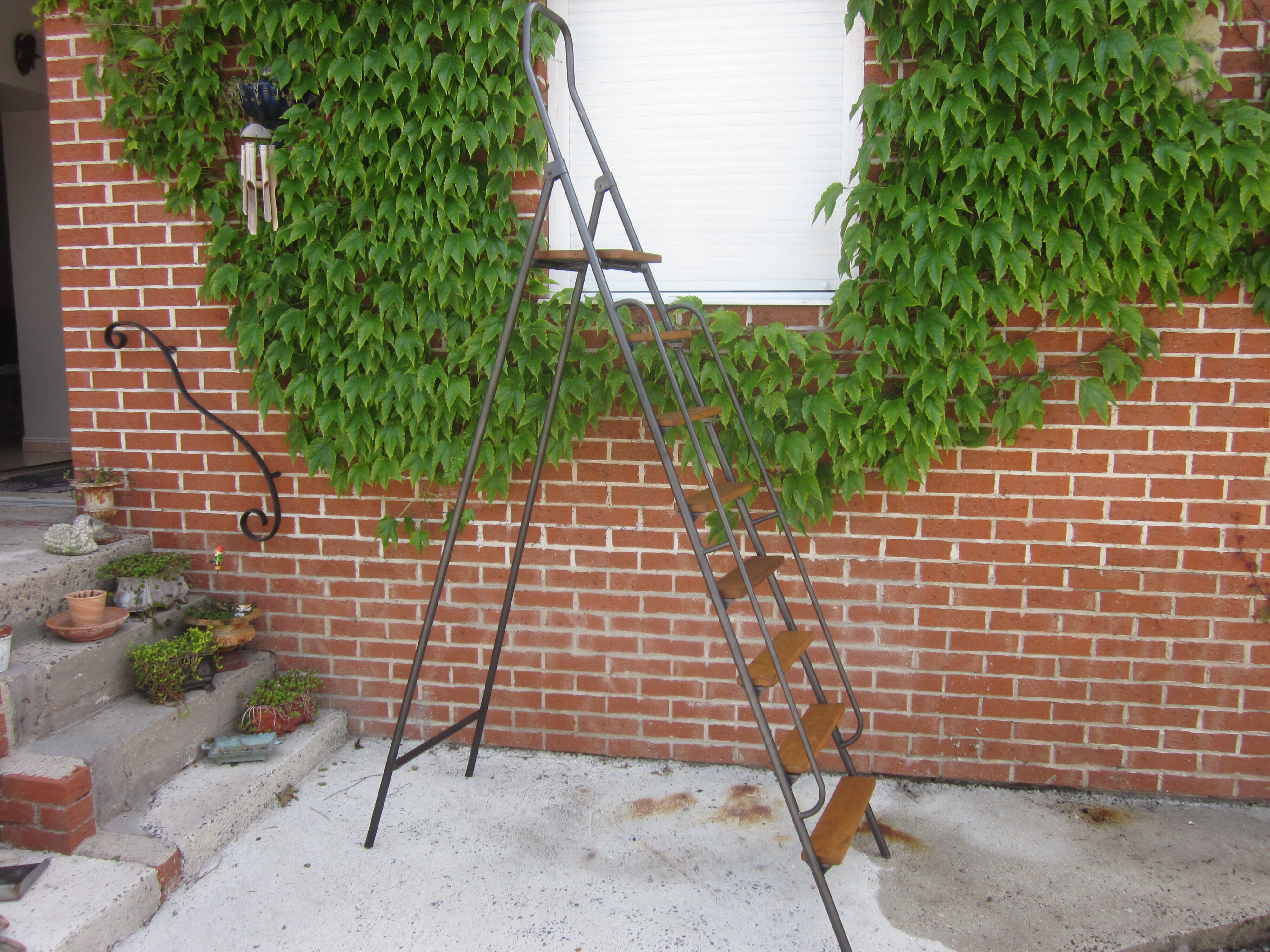 Old stepladder in metal and wood