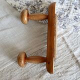 Antique wooden coat rack with two round hooks