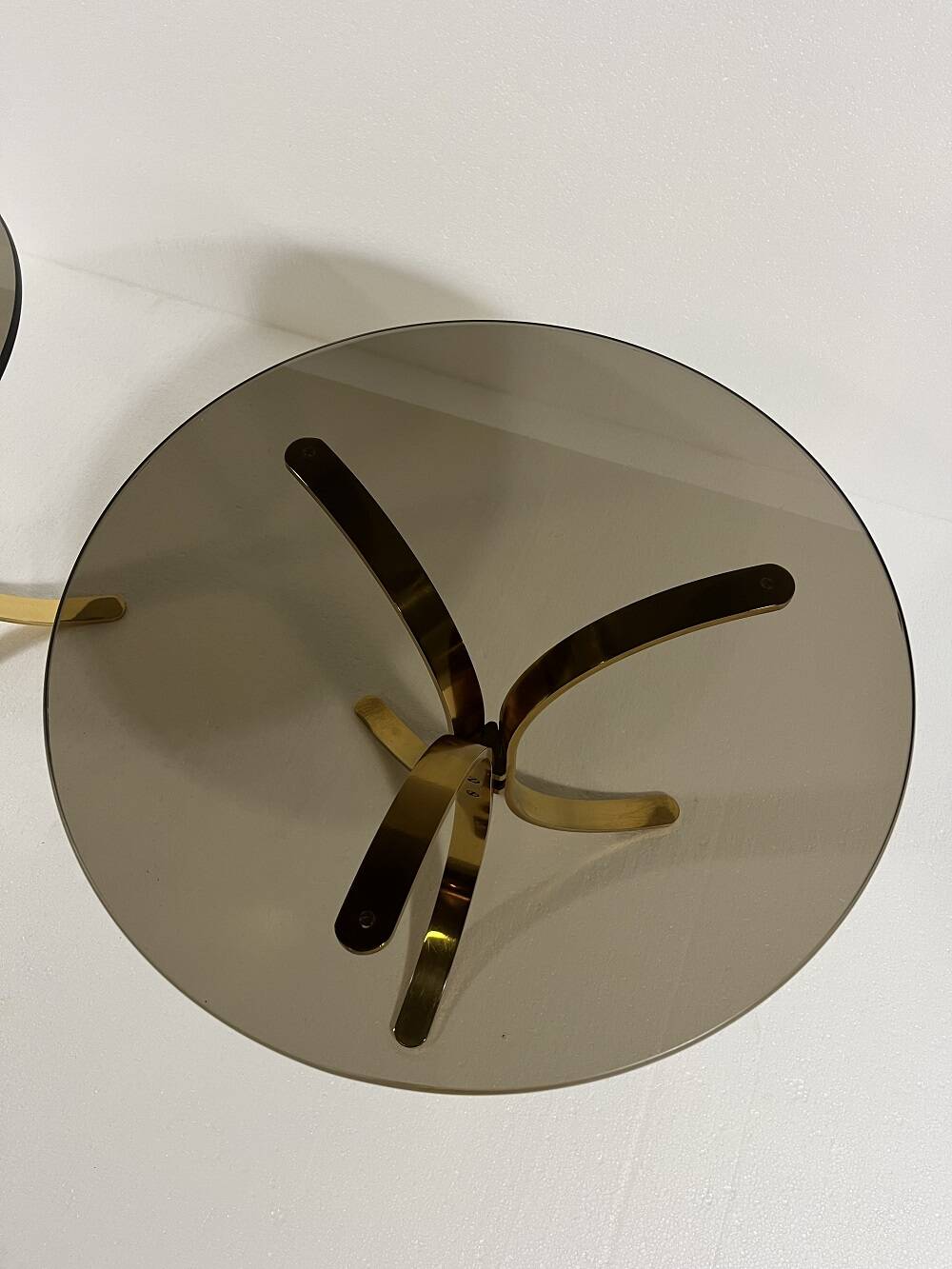 Brass and smoked glass side tables from the 1960s.