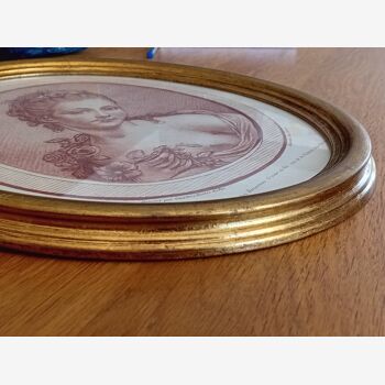 Engraving young girl in oval golden frame