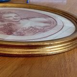 Engraving young girl in oval golden frame