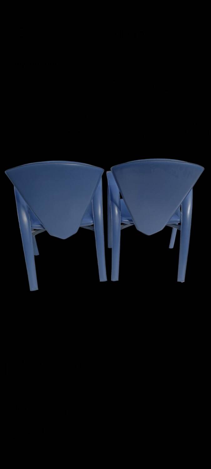 Armchairs covered in vintage blue leather