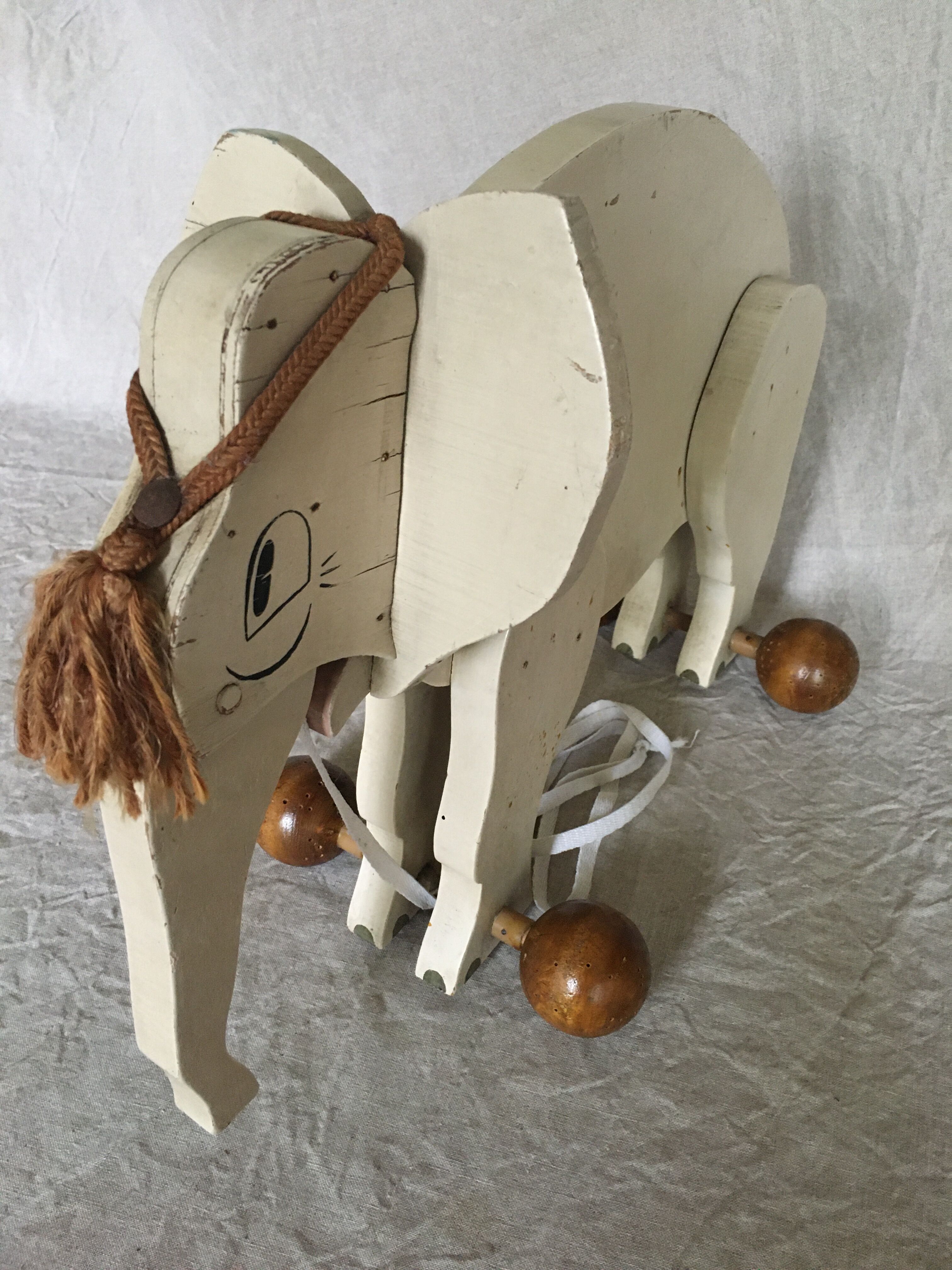 Wooden elephant on wheels