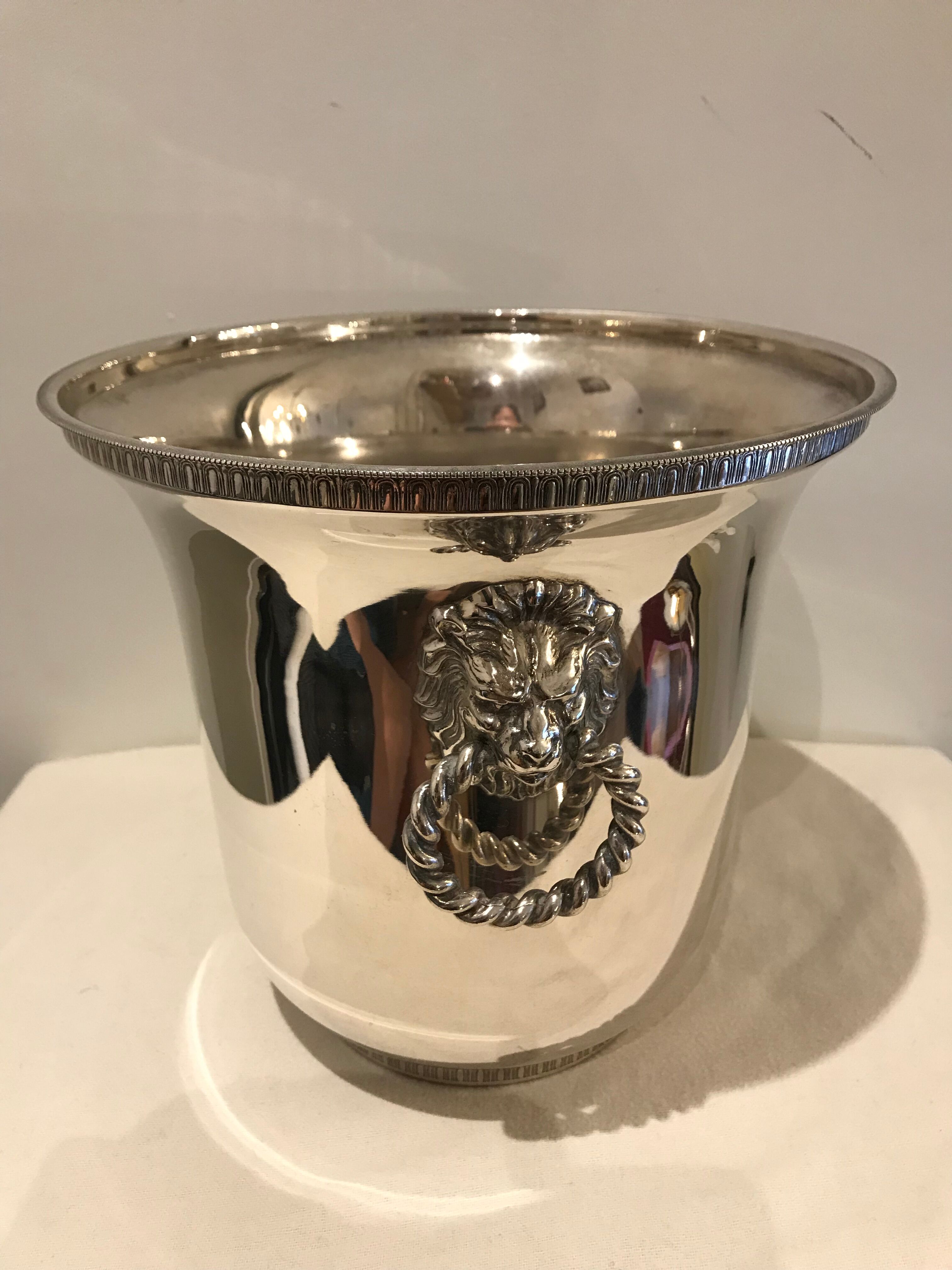 Ancient champagne bucket in silver metal with lion heads