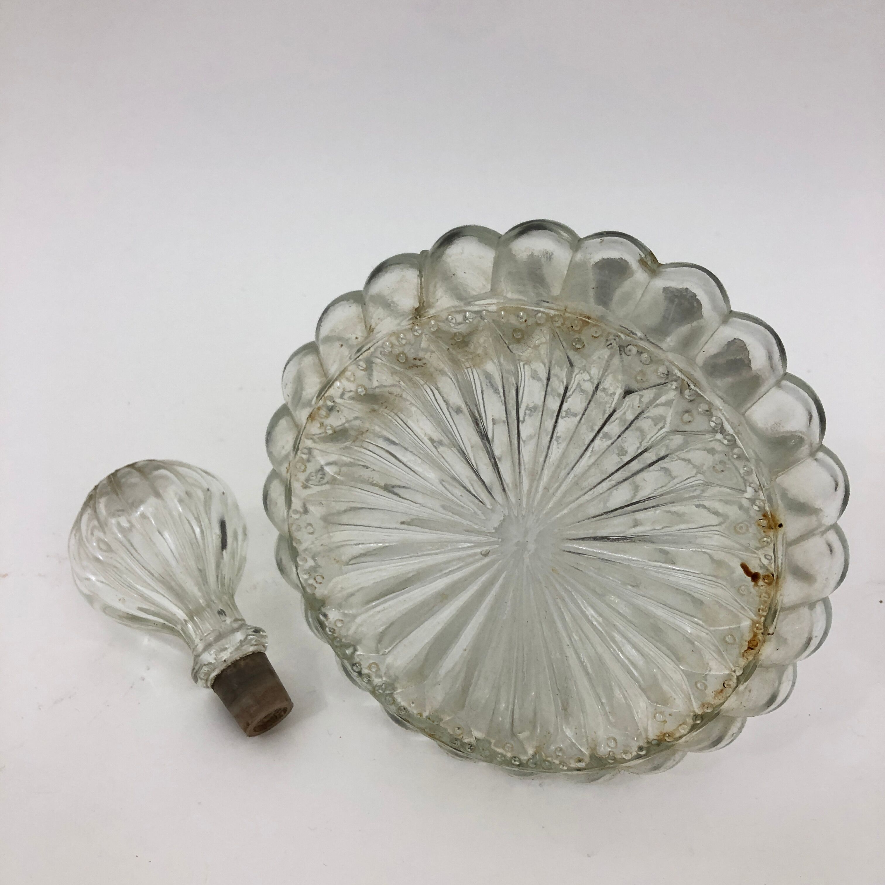 Large glass decanter and tin ring