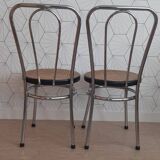 Pair of chrome and cane bistro chairs from the 70s.