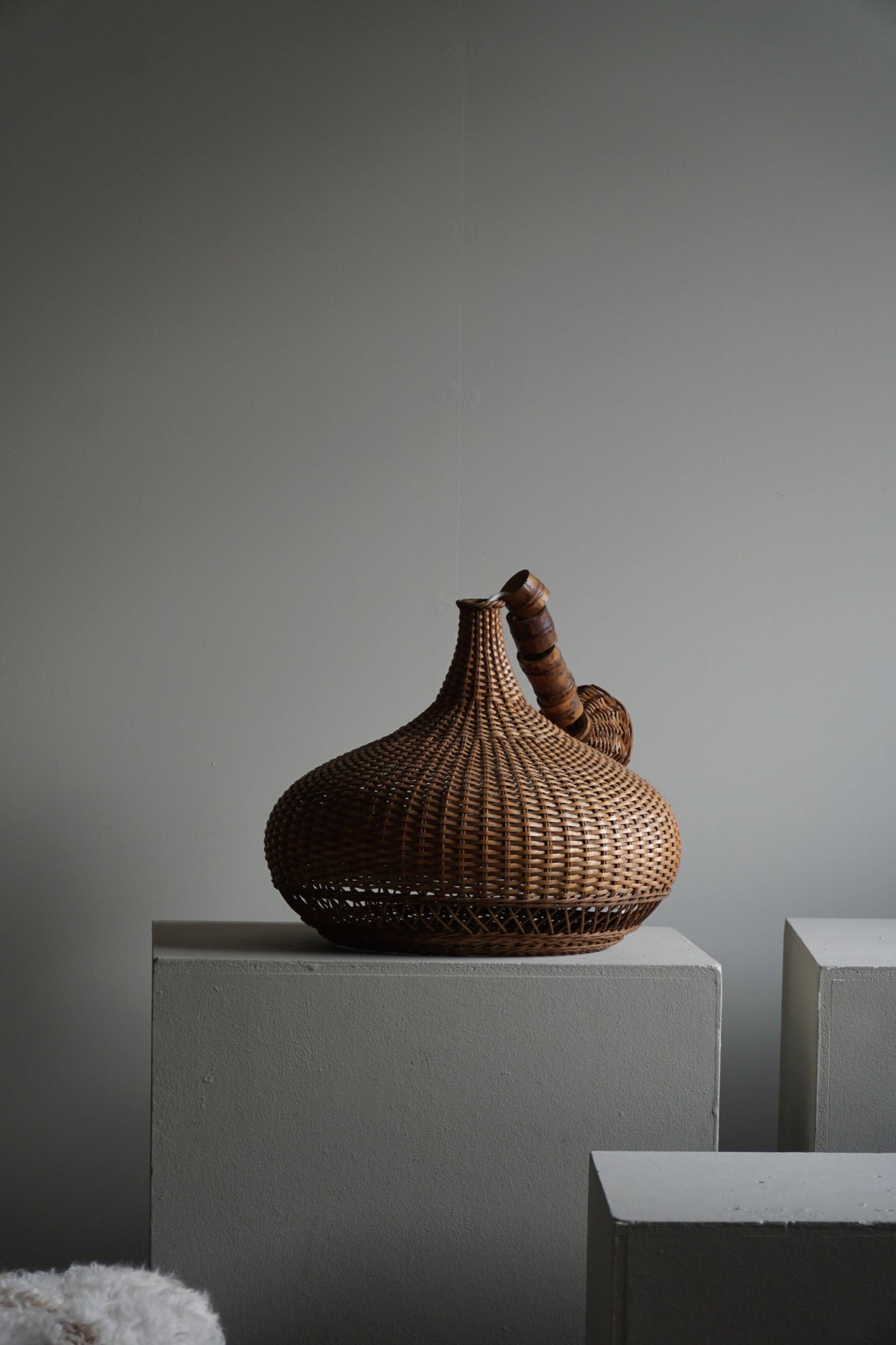 Vintage Danish mid-century rattan pendant light, made in the 1960s.