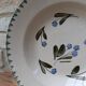 Old deep iron earth plate with blue flower pattern