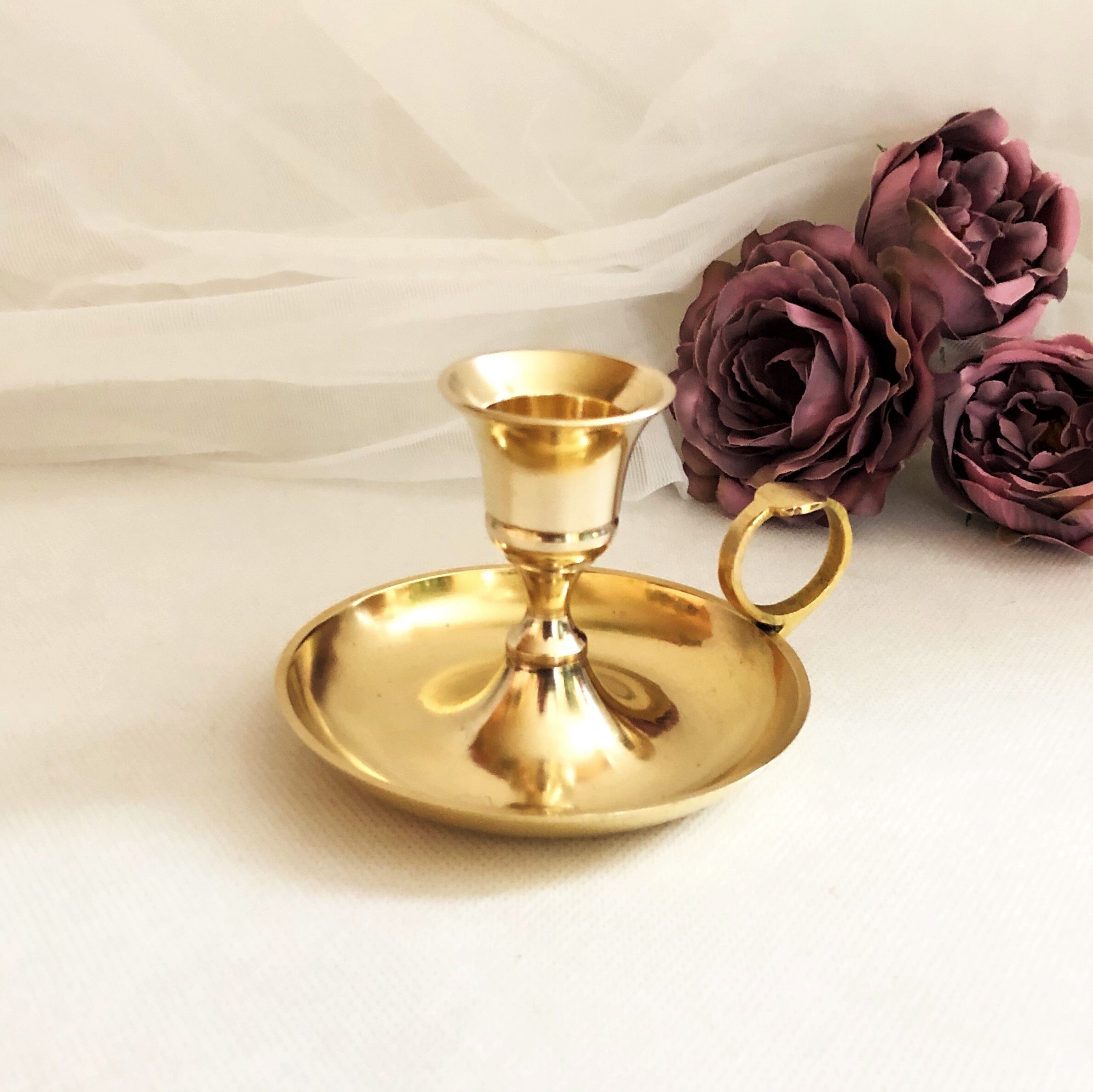 Gilded brass hand candle holder