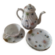 coffee pot, cup and saucers