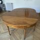 Large oval table from the early 19th century in walnut, 3.17m with extensions.