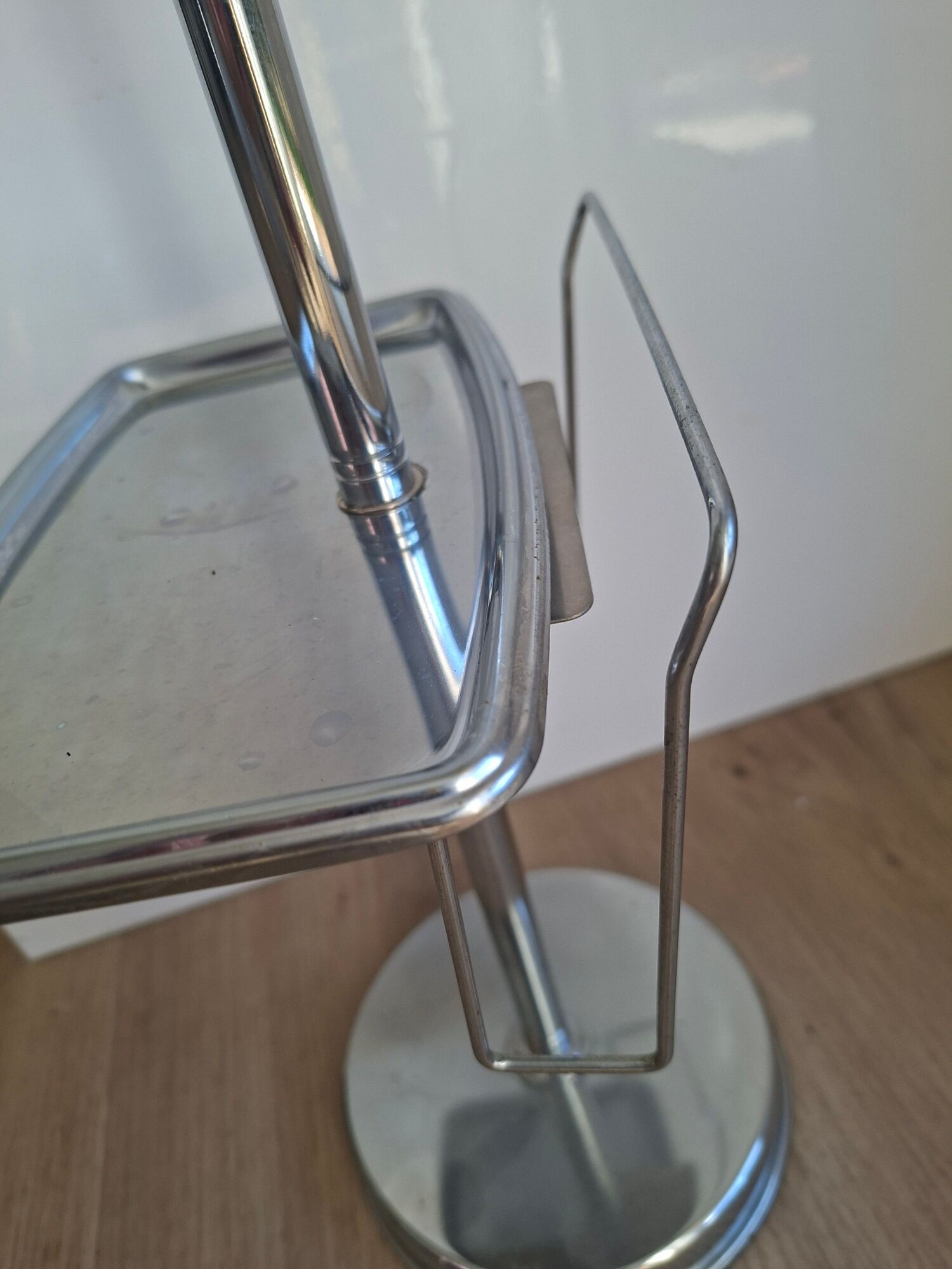 Vintage chrome metal floor ashtray with integrated tray.