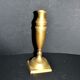 Antique baluster candlestick in bronze with hand-chiseled design.