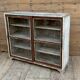 Teak display cabinet with sliding doors
