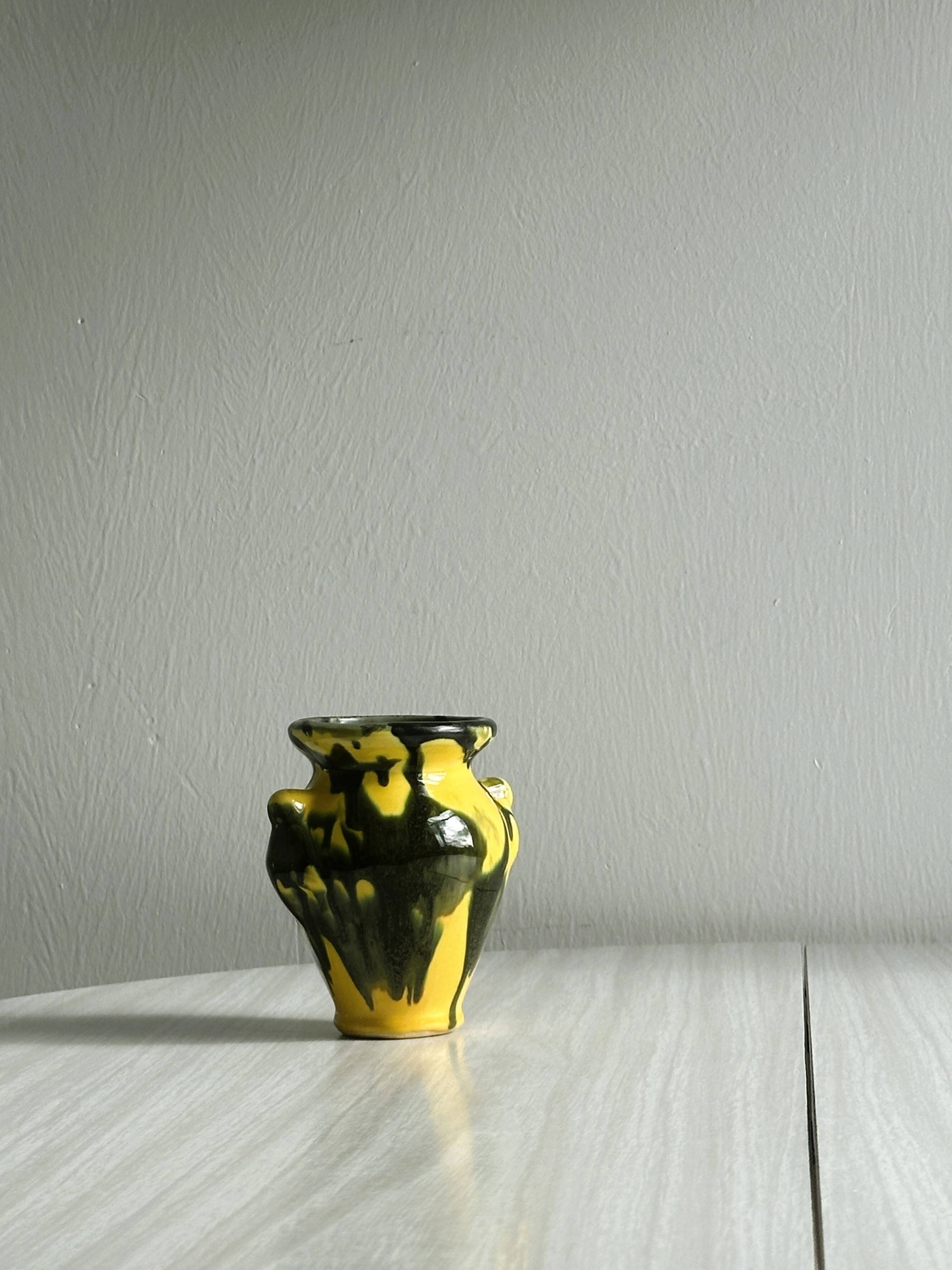 Small yellow and green ceramic vase