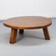 Large vintage round coffee table in raw oak brutalism.