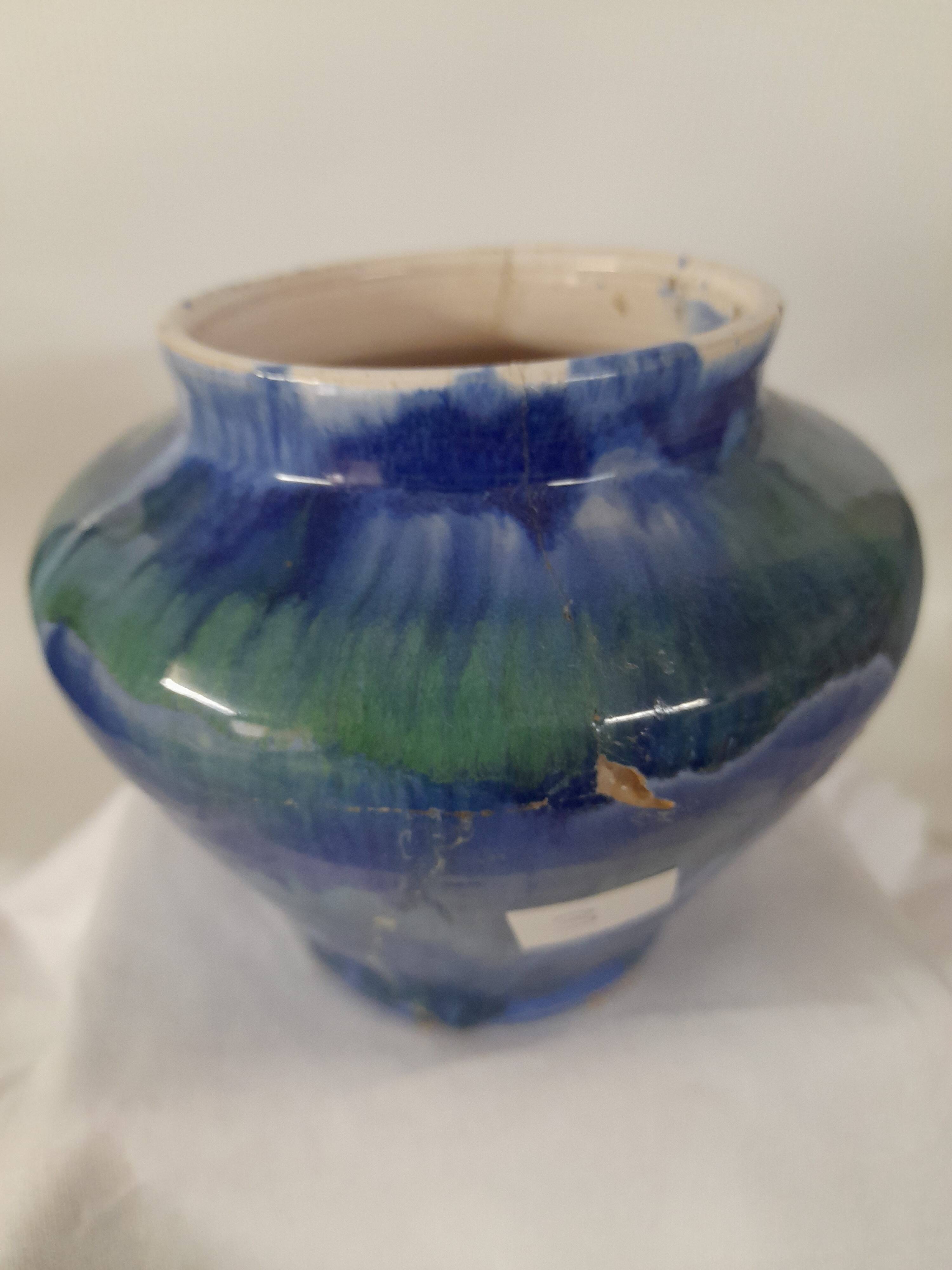 a blue flamed stoneware vase