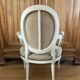 Upholstered armchair with cross-stitch in the Louis XVI style, 19th century.