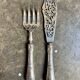 2 silver openwork service cutlery sets engraved with "AS"