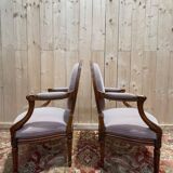 Pair of Louis XVI cabriolet armchairs with medallion backrest.